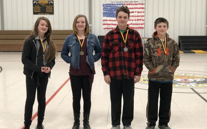 Winners of the Strain-Japan Science Fair for 2018 are: Keeley Lechten and Elle tied for first place; Kaleb with the second place win; and Cade with the third place win.