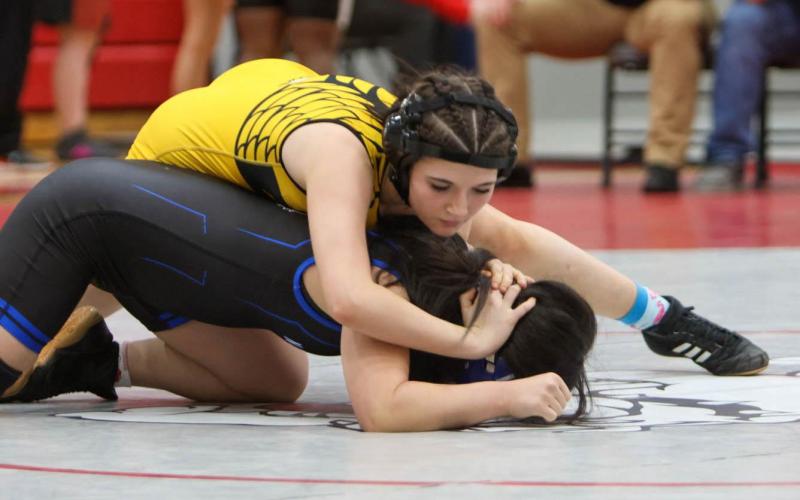 TOOTH-AND-NAIL. Freshman Autumn Hardesty left everything on the mat in St. Clair, giving her opponents a tough fight worth remembering. Photo by Heidi Blankenship Article Image Alt Text
