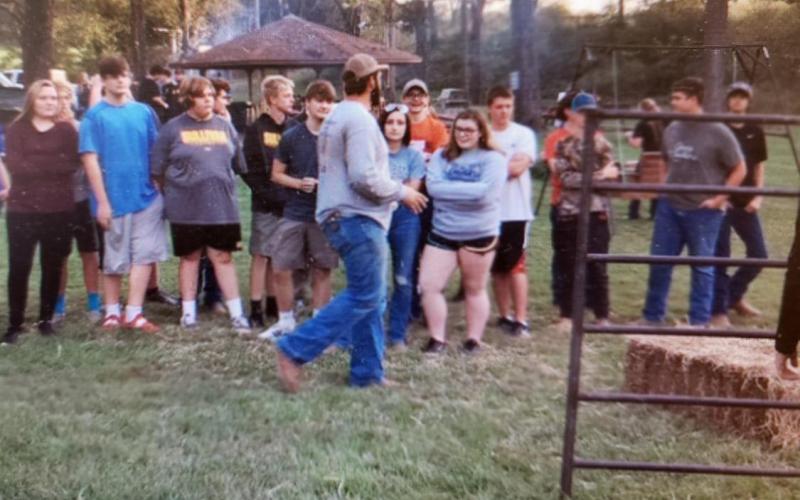 Chapter President Tyler Hesse prepares students for the bale stacking competition at the September FFA meeting held at Rohrer Park.