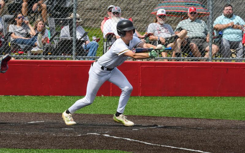 NATE McREYNOLDS is pictured making a bunt. Photo by Wyatt Hardy Article Image Alt Text
