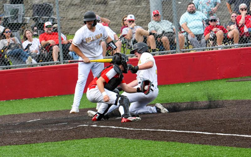 SURF THE TURF. Chase Blue slides into home plate. Photo by Extra Innings Photography Article Image Alt Text