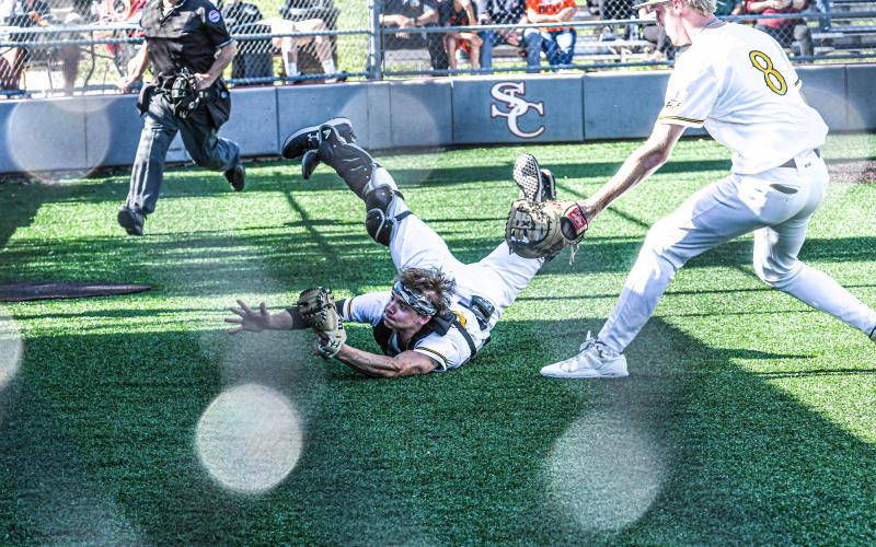LIKE AN ACROBAT. Alex Toews is pictured making his jaw-dropping catch for Owensville’s final out in the bottom of the fourth. Photo by Extra Innings Photography Article Image Alt Text