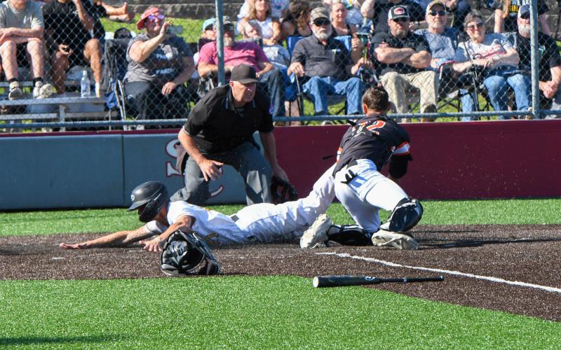 RAIDEN REDD slides home for the second score. Photo by Extra Innings Photography Article Image Alt Text
