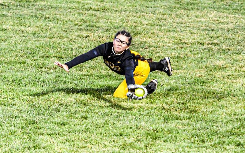 KENNEDI ROACH dives to catch a Blair Oaks out. Photo by Extra Innings Photography Article Image Alt Text
