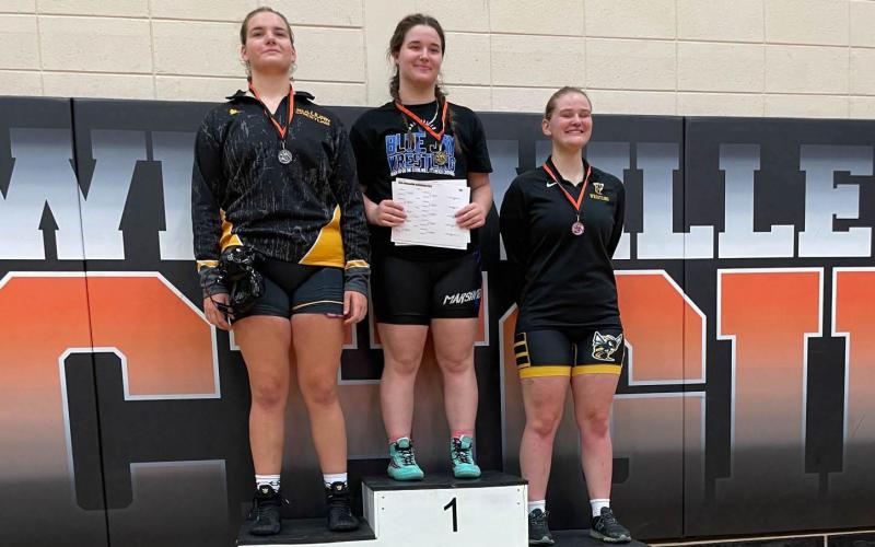 ABIGAIL ERFURTH (left) medaled in second place in the 235 class. Photo by Sullivan High School Wrestling X Article Image Alt Text
