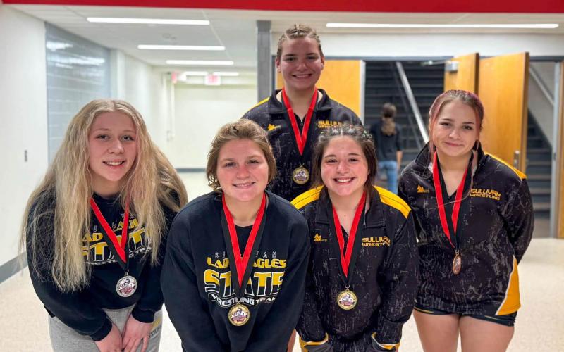 GLADIATORS OF THE RING. The Lady Eagles brought home five medals from Jefferson City on Saturday, Dec. 21. Pictured from left to right in the front row, the podium clinchers were Ruby Daily (2nd), Dorie Richardson (1st), Chloe Carson (1st) and Starr Hardesty (3rd). Abigail Erfurth (1st) is pictured in the back. Photo via Sullivan Lady Eagles Wrestling Facebook Article Image Alt Text