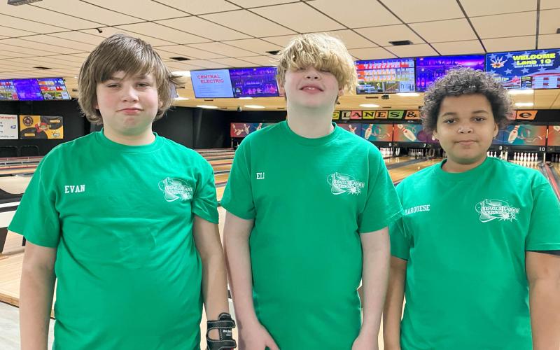 DO THE DEW. Team Mtn. Dew lit up the lanes with strikes last Saturday. They are pictured from left to right: Evan Embry, Eli Evans and Marquese Ayers. Submitted photo Article Image Alt Text