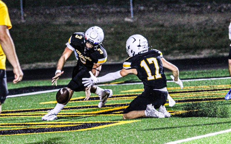 LOOSE BALL. Robert York (3) and Oliver Borton (17) attempt to intercept a tipped Lutheran South pass. Photo by Wyatt Hardy Article Image Alt Text