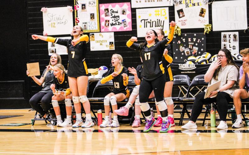 AYE-AYE-ACE. Abby Record (7) and Chloe Carson (17) celebrate after a teammate executed an ace. Photo by Wyatt Hardy Article Image Alt Text