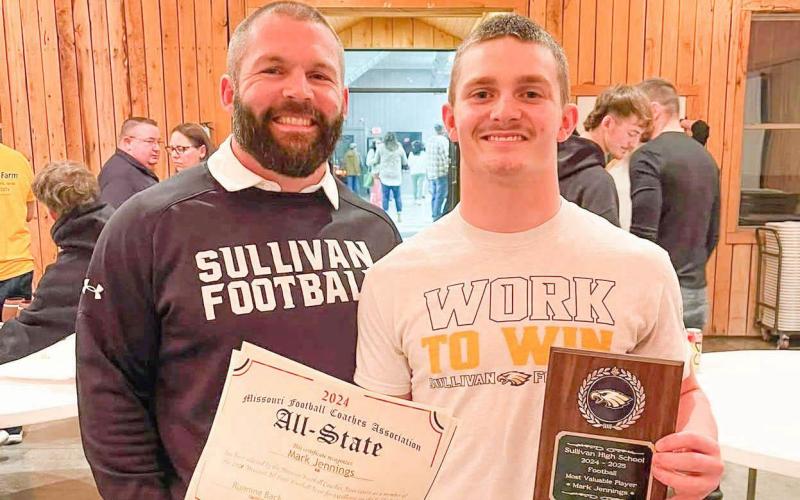 MOST VALUABLE PLAYER. Mark Jennings (right) received the MVP Award from the Eagles and was named third-team all-state. He was Sullivan’s leading rusher with 1512 yards and is pictured alongside his head coach, Eddie Haar (left). Photo by Nikki Jennings Article Image Alt Text