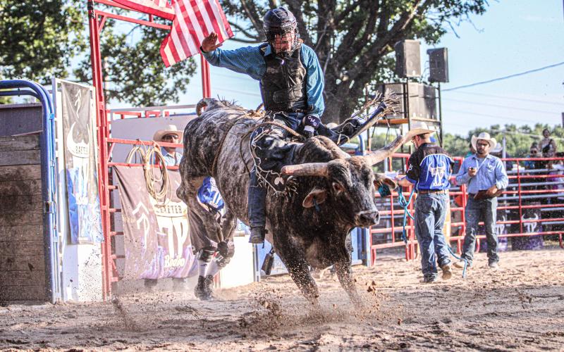 HOEDOWN. The riders attempted to do-si-do with the bulls before a throw-down. Photo by Wyatt Hardy Article Image Alt Text