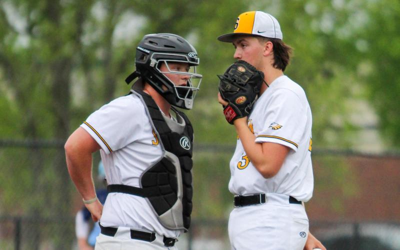 DIAL IT UP. Eagles catcher Anden Carey (left) meets with pitcher Lucas Parsons during the Salem game. Photo by Wyatt Hardy Article Image Alt Text