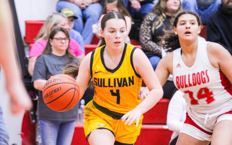 DELANEY GEORGE (4) achieved a career-high of 18 points against St. Clair in the Class 4 District 3 quarterfinal on Monday, Feb. 26. She and the other two seniors, Hayli Venable and Raegan Johnson, fought hard to ensure their last game as Lady Eagles wasn’t a loss to their biggest rivals. Photo by Wyatt Hardy @ 2/2 St. Clair vs. Sullivan game Article Image Alt Text