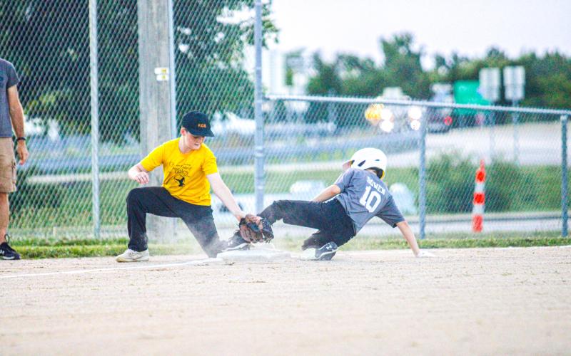 SLIP N’ SLIDE. Adyn Bowen (10) of 7 Cedars took a clutch dive through third base. Photo by Wyatt Hardy Article Image Alt Text