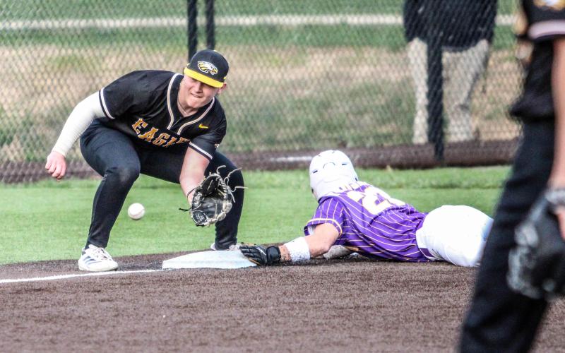 CHASE BLUE attempts to make an out at third base. Photo by Wyatt Hardy Article Image Alt Text