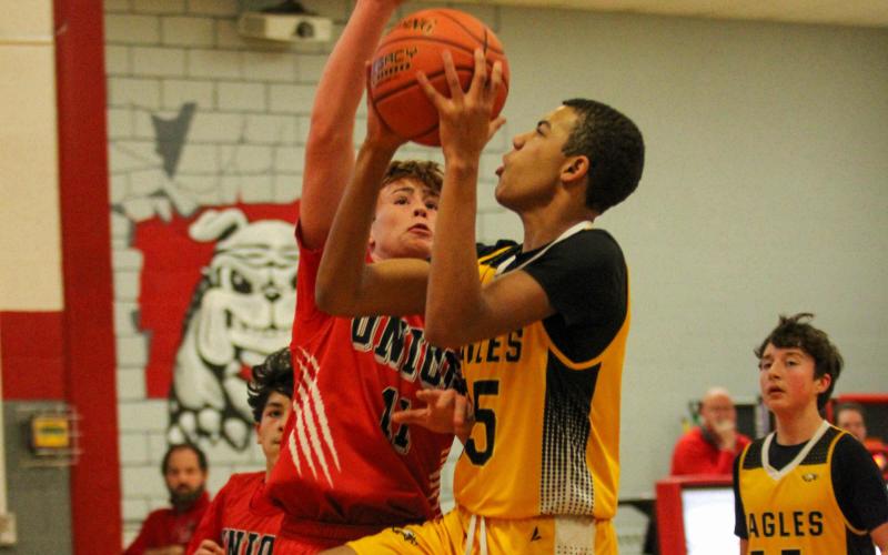 JEREMIH JENKINS drives to the basket. Photo by Wyatt Hardy Article Image Alt Text
