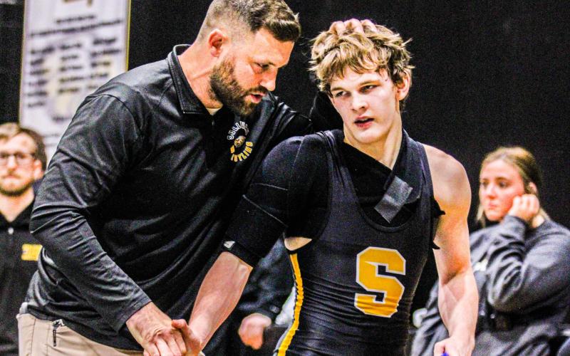 KINGS OF THE RING. Head coach Carl Lawrence won All-Area Coach of the Year, and junior Eli Peregoy was named a first-team all-area wrestler. Photo by Wyatt Hardy Article Image Alt Text