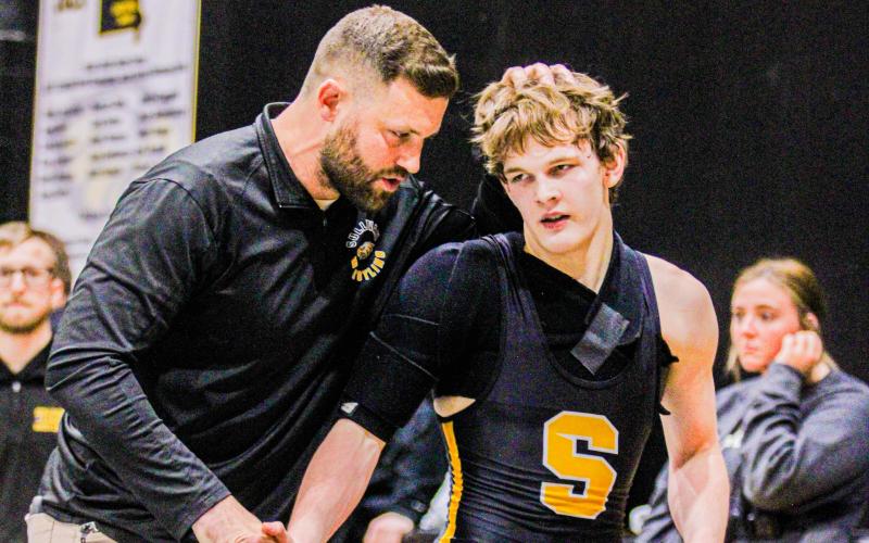 EAGLES DOMINATE ALL-AREA AWARDS. Sullivan head coach Carl Lawrence (left) won All-Area Coach of the Year, and Eli Peregoy (right) was selected for the first team in the 138 weight class. Photo by Wyatt Hardy Article Image Alt Text