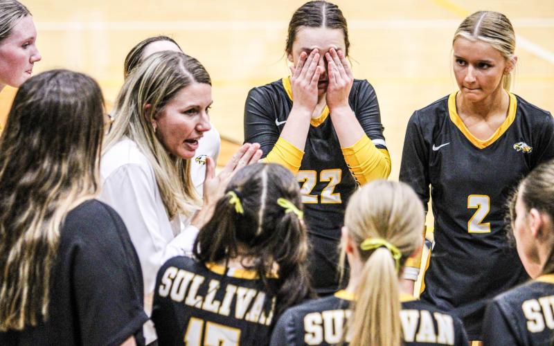 SEASON ON THE LINE. Head coach Sarah Rochleau told Sullivan to stay calm during the final timeout. Photo by Wyatt Hardy Article Image Alt Text