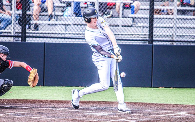 DRAKE GAWER steps up to the plate and uses all his power to launch the ball. Photo by Wyatt Hardy Article Image Alt Text