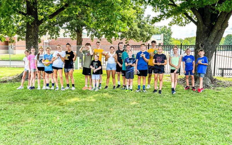 PASSING THE BATON. Sullivan’s XC country program trained its future runners at a youth camp at the high school from July 8 to 11. The kids were taught the proper techniques so they would be ready to take the baton once it was passed to them. Photo by assistant coach Amy O'Dell Article Image Alt Text