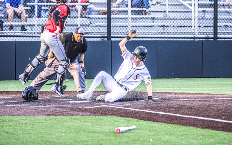SURF ON THE TURF. Seth Valley tallies a run as he slides home. Article Image Alt Text