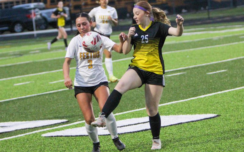 HAILEY MASTIN (25) grapples with a Festus Tiger. Photo by Wyatt Hardy Article Image Alt Text