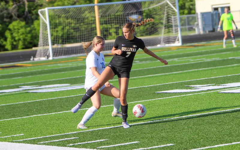 EDEN LAMBERT duels a Lady Knight for the ball. Photo by Wyatt Hardy Article Image Alt Text
