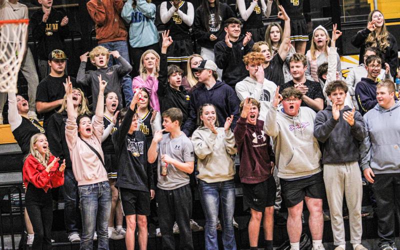 FROM DOWNTOWN. The Pep Club cheered on Sullivan for each three they shot. Photo by Wyatt Hardy Article Image Alt Text
