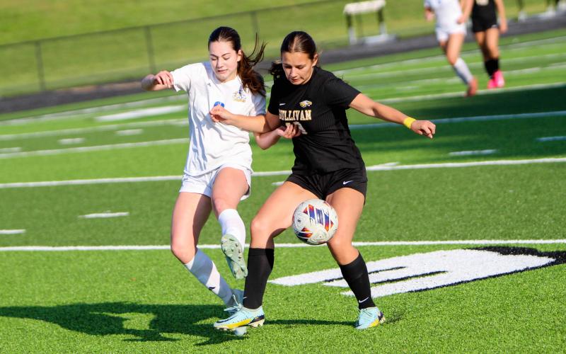 ELLA KIRK tussels with a Borgia player on the field. Photo by Wyatt Hardy Article Image Alt Text