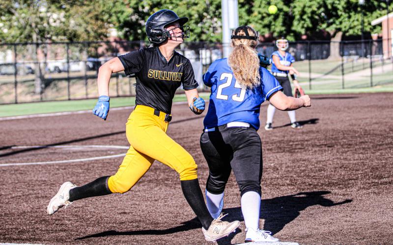 CARLI McCREARY barely lands on first base. Photo by Wyatt Hardy Article Image Alt Text