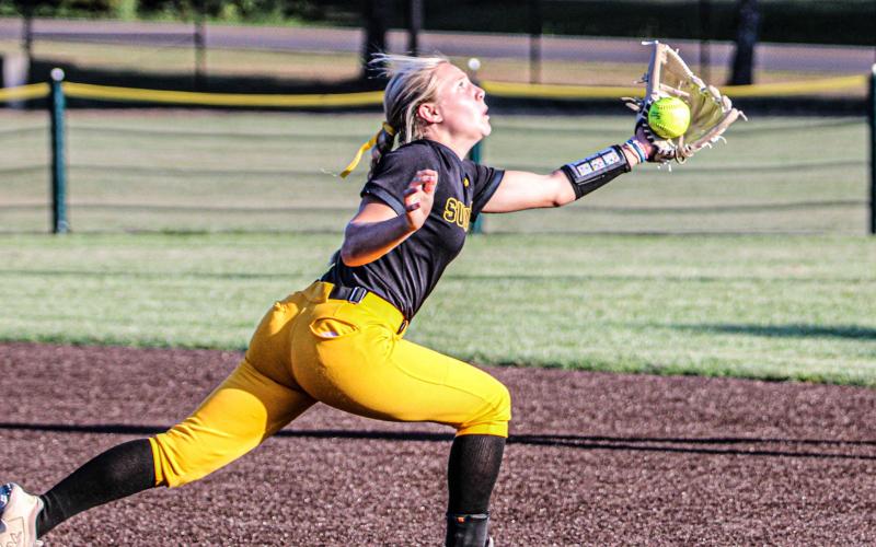 RAE CORWIN tries to catch an out by the foul line. Photo by Wyatt Hardy Article Image Alt Text