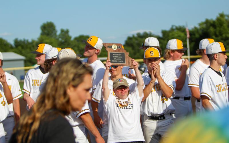 MATT DOZA, Sullivan’s No. 1 fan, is pictured holding the district plaque. Photo by Wyatt Hardy Article Image Alt Text