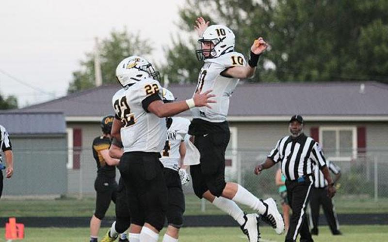 Jeremiah Rodriguez (left) celebrates with Gabe Dace (right) on Friday after scoring a touchdown in Sullivan's 54-6 win over the Cuba Wildcats Article Image Alt Text