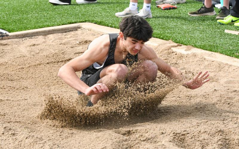 BRENNAN KOEPKE took fourth in the long jump. Photo by Extra Innings Photography Article Image Alt Text