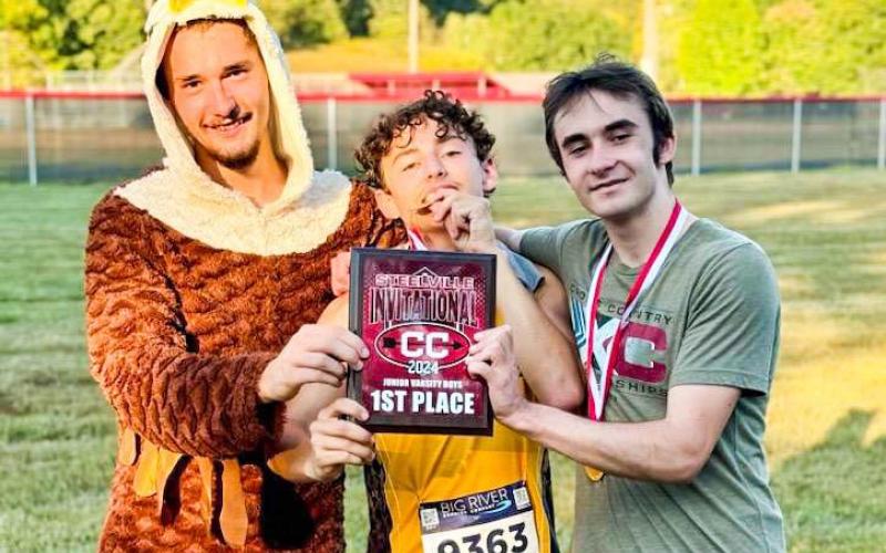 JV CHAMPS. Three Sullivan runners from the JV cross country team hold the first-place plaque they won at Steelville. William Hunter, Ayden Duncan and Samuel Simington are pictured from left to right. Photo via Sullivan XC X Article Image Alt Text