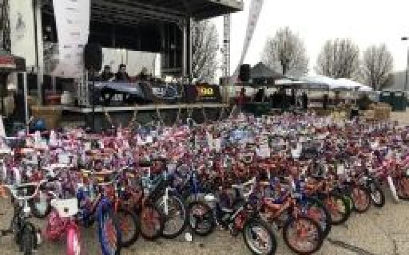 Last year’s donated bikes freshly assembled by the Jim Butler crew are displayed in front of the main stage after being paraded into the event.