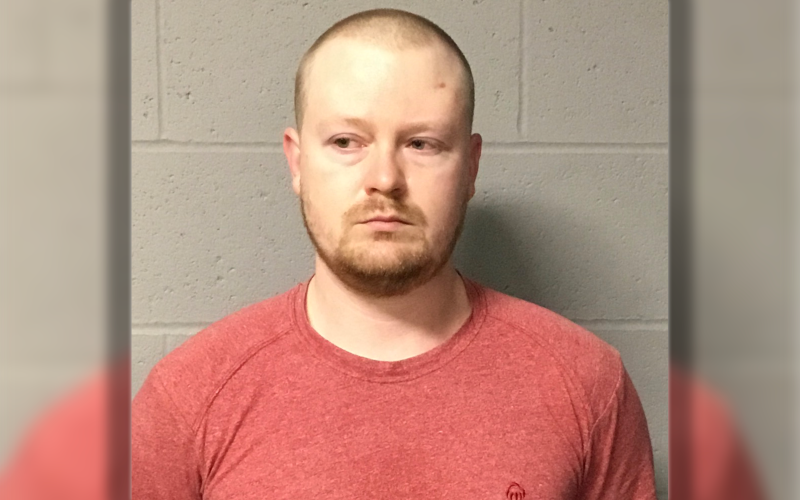 Thomas Eckert's mugshot, white male, buzzcut, scruffy facial hair, red t-shirt