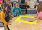 Alyssa, Emileigh, and Ava working on putting together a 100 piece puzzle upside down!