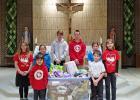 BABY SHOWER: Student representatives show the items collected for the Pregnancy Assist. Center in Washington.