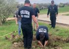 Firefighters work to free Elvis from a culvert pipe. Article Image Alt Text