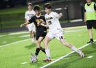 KICKING OFF A NEW SEASON. Dayton Head (left) and Thomas Tod (right) battle on the field. Photo by Wyatt Hardy Article Image Alt Text
