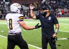 GIMME FIVE. Chase Blue (left) celebrated his score by high-fiving his head coach Eddie Haar (right). Photo by Wyatt Hardy Article Image Alt Text