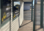 The damage from the accident is quite visible on the front wall of Express Pawn as the vehicle hopped the concrete car barrier and struck the wall, causing what was described as a “loud bang” by customers inside the store. The damage from the accident is quite visible on the front wall of Express Pawn as the vehicle hopped the concrete car barrier and struck the wall, causing what was described as a “loud bang” by customers inside the store.